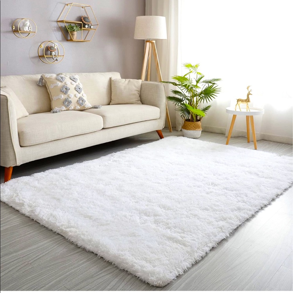 Very very plush soft area rug still in box. I have one in my room that I love!